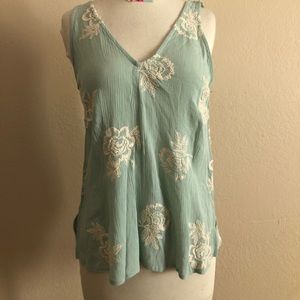 Teal top with white embroidery flowers size small